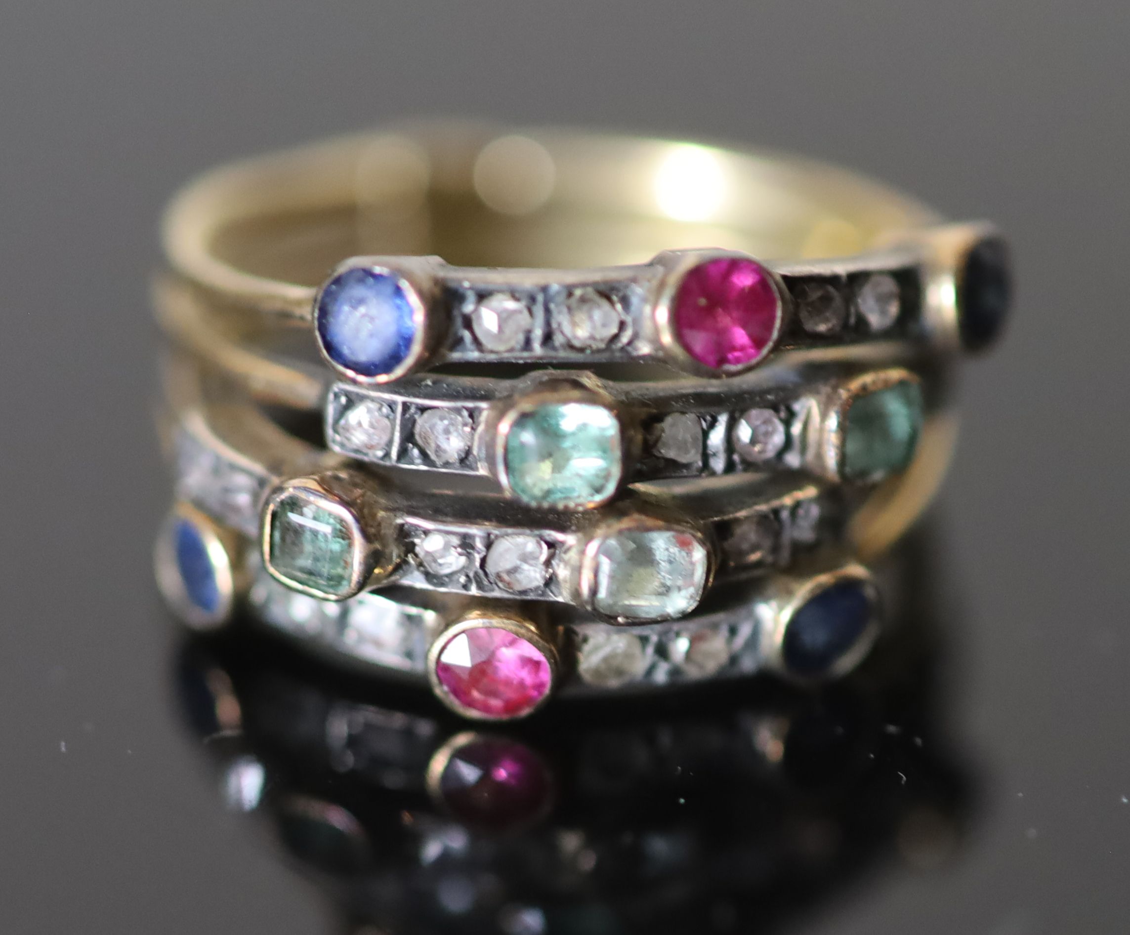 A 19th century gold, sapphire, ruby, emerald and rose cut diamond set quadruple shank half hoop ring,
